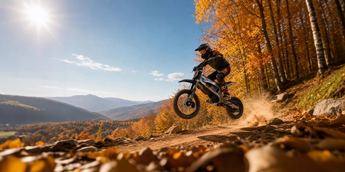 KuKirin X1 electric dirt bike riding through autumn mountain off‑road trail, premium off‑road motorcycle