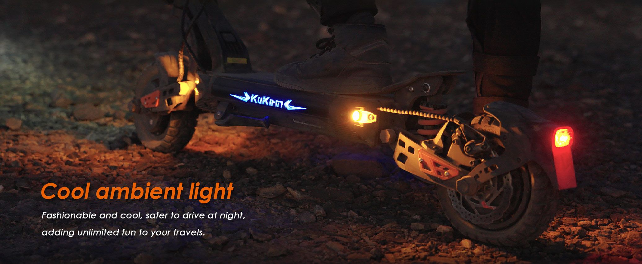 KuKirin G2 Master electric scooter at night showing glowing ambient lights and rear taillight