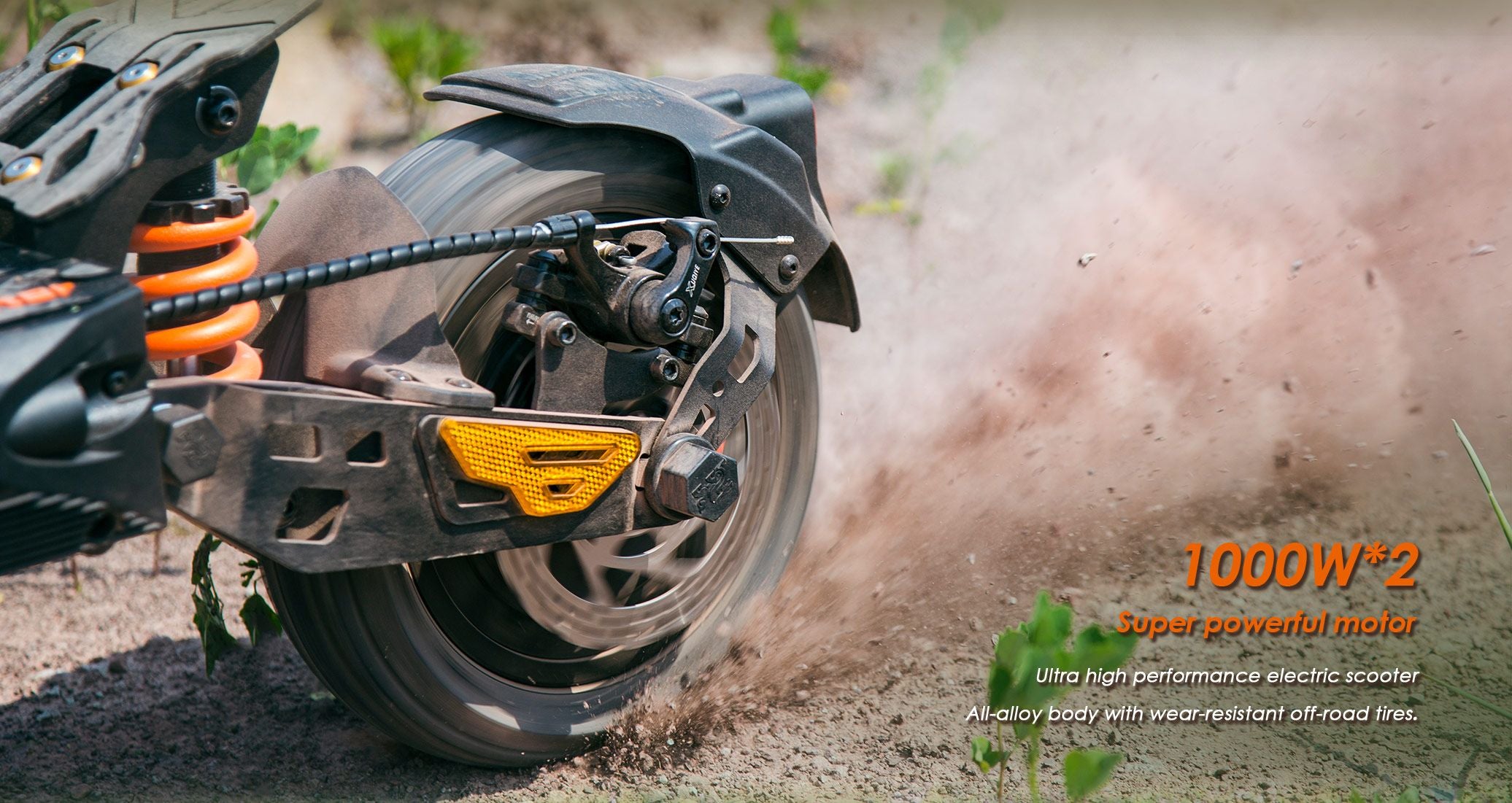 KuKirin G2 Master close‑up view of rear wheel dual motor and off‑road tire kicking up dirt