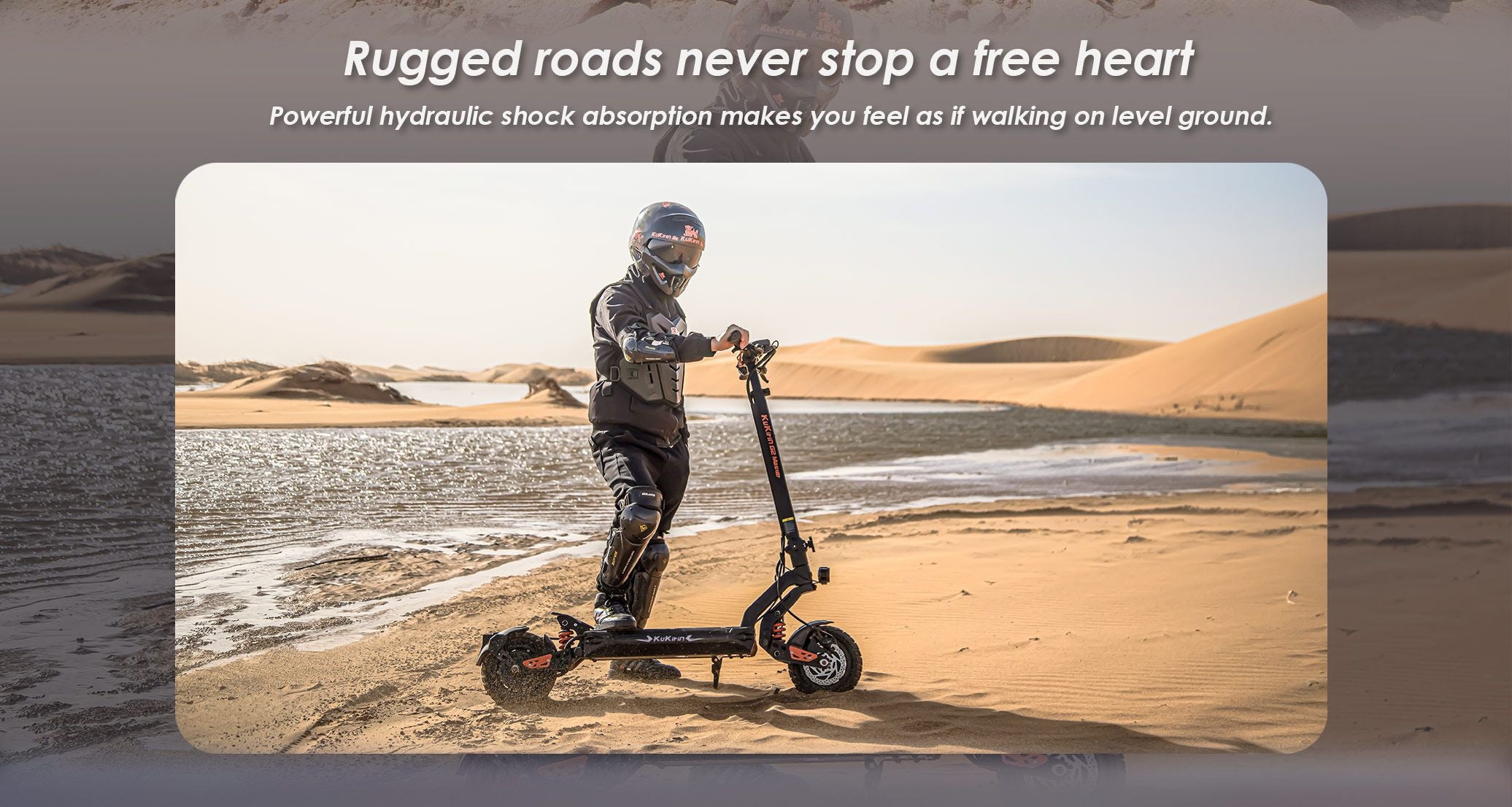 KuKirin G2 Master electric scooter with full‑gear rider standing on sandy desert off‑road terrain