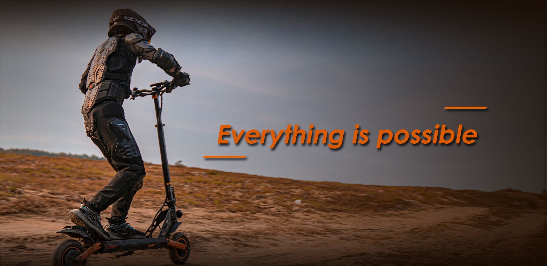 KuKirin G2 Pro electric scooter off‑road riding scene with protective gear