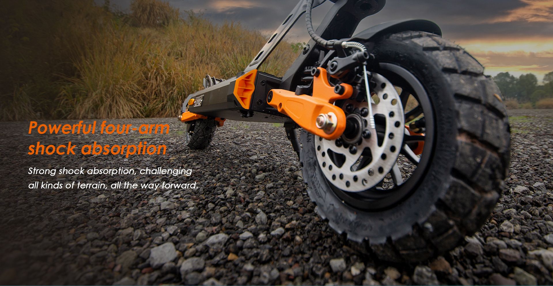 KuKirin G2 Pro VMP DGT certified electric scooter close‑up of four‑arm shock absorption suspension on gravel off‑road terrain
