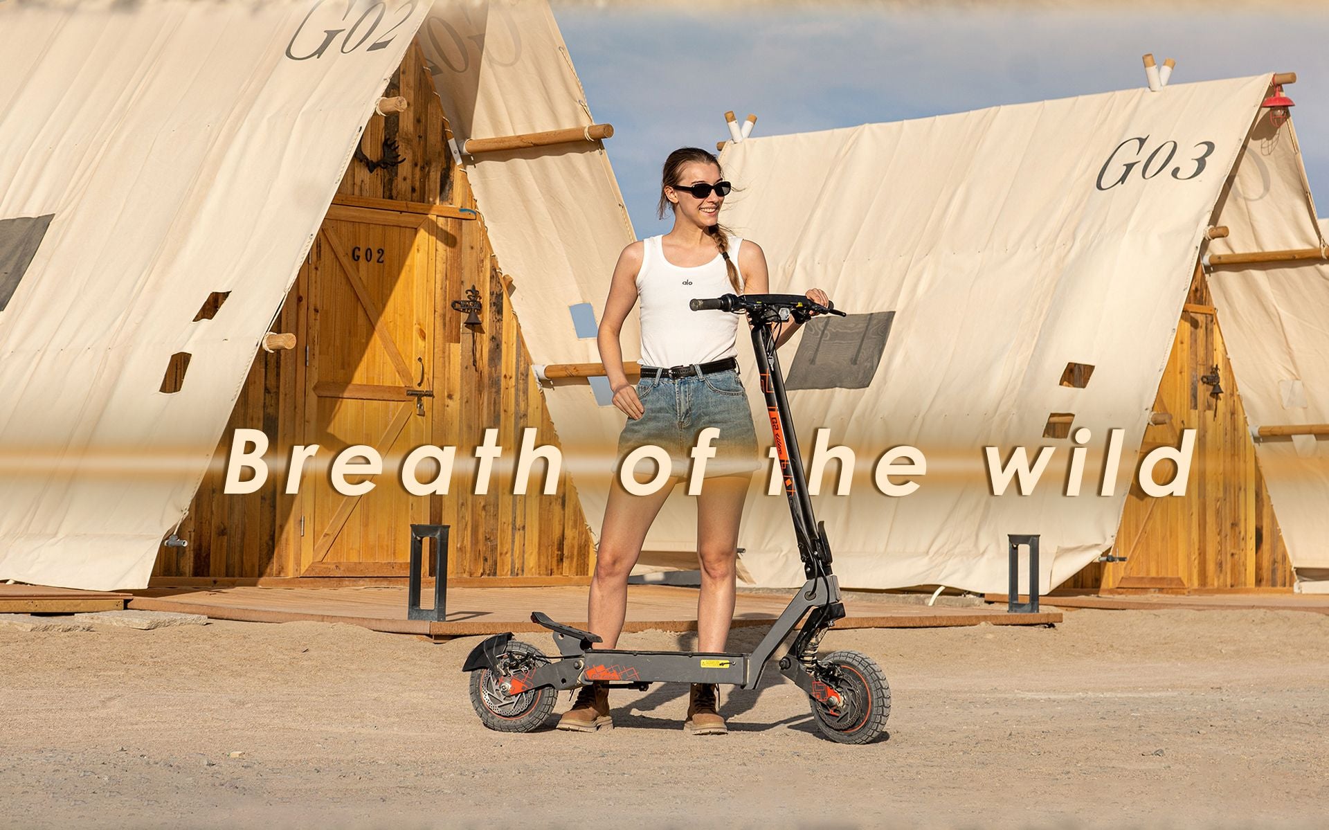 KuKirin G2 Ultra foldable electric scooter with woman at outdoor glamping campsite