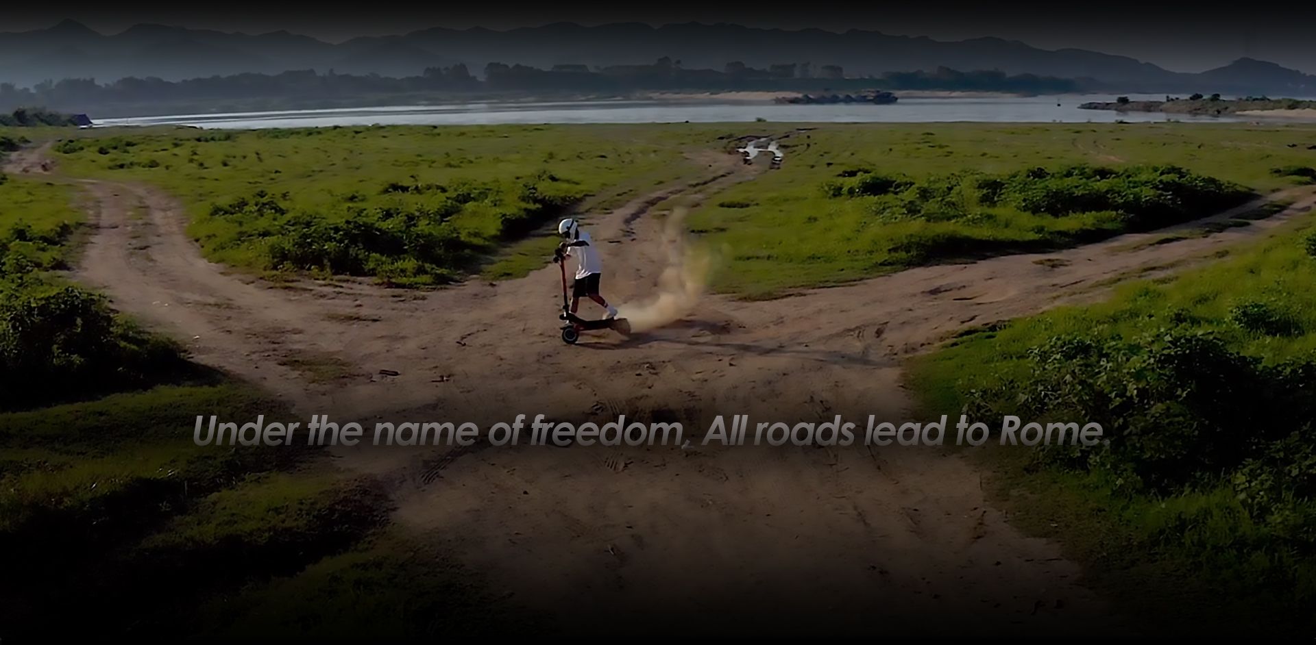 KuKirin G3 Pro off‑road electric scooter action shot rider riding on dirt terrain outdoor countryside scene