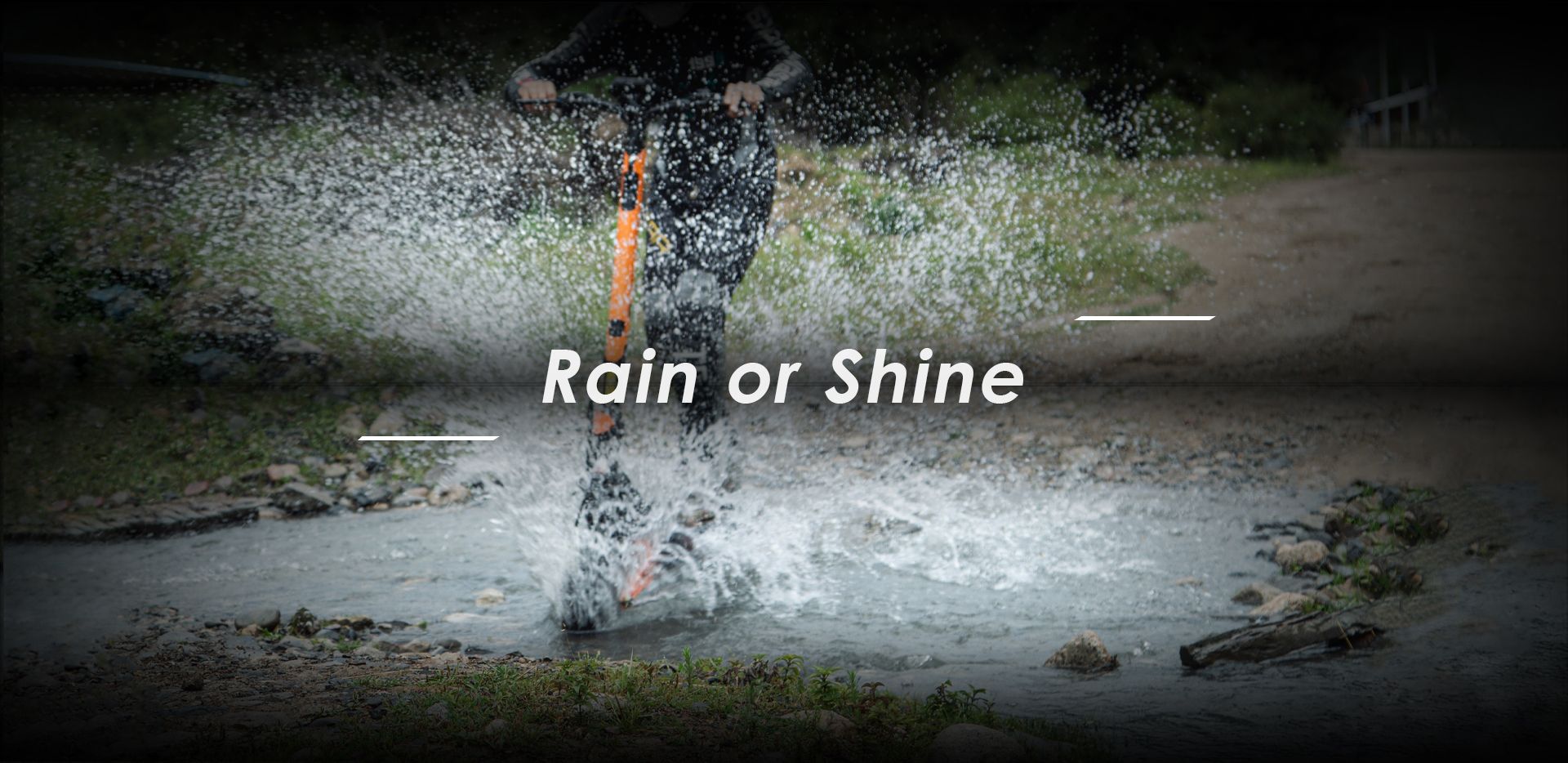 KuKirin G3 Pro off‑road electric scooter rider splashing through stream showing waterproof performance in wet conditions