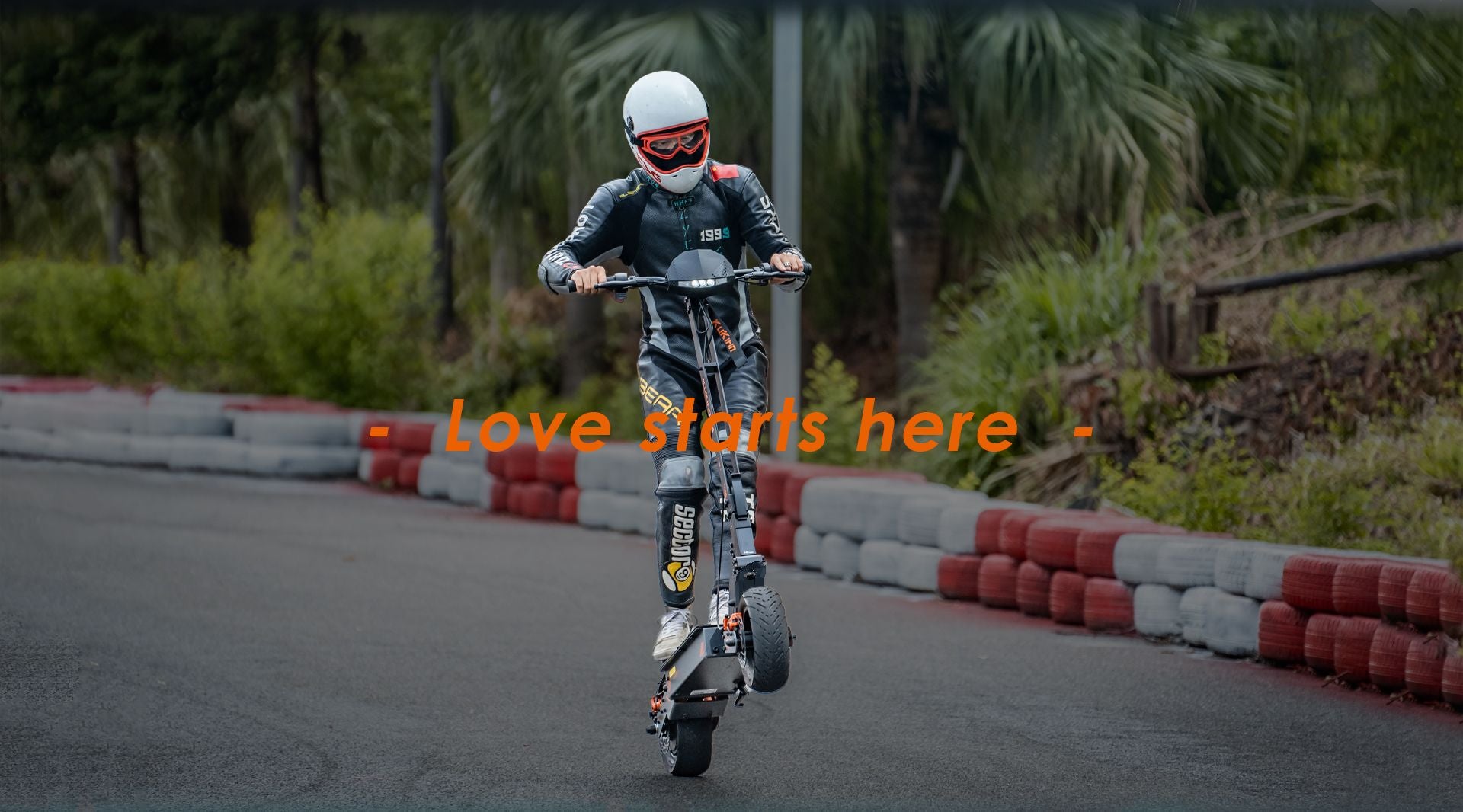 KuKirin G4 high‑performance electric scooter ridden by rider with helmet on race track