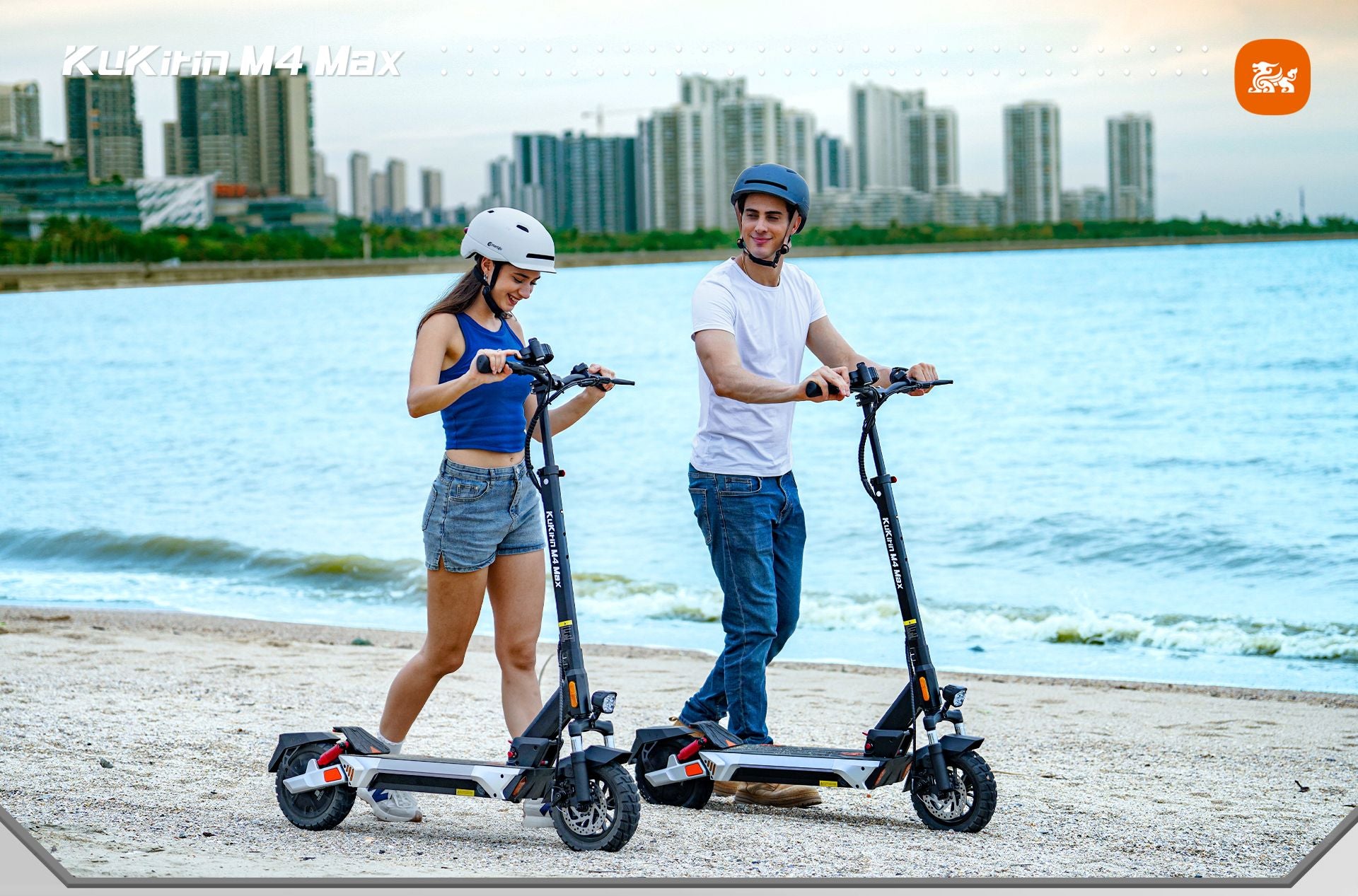 KuKirin M4 Max adult foldable electric scooter, two riders riding scooters at seaside beach, outdoor lifestyle shot