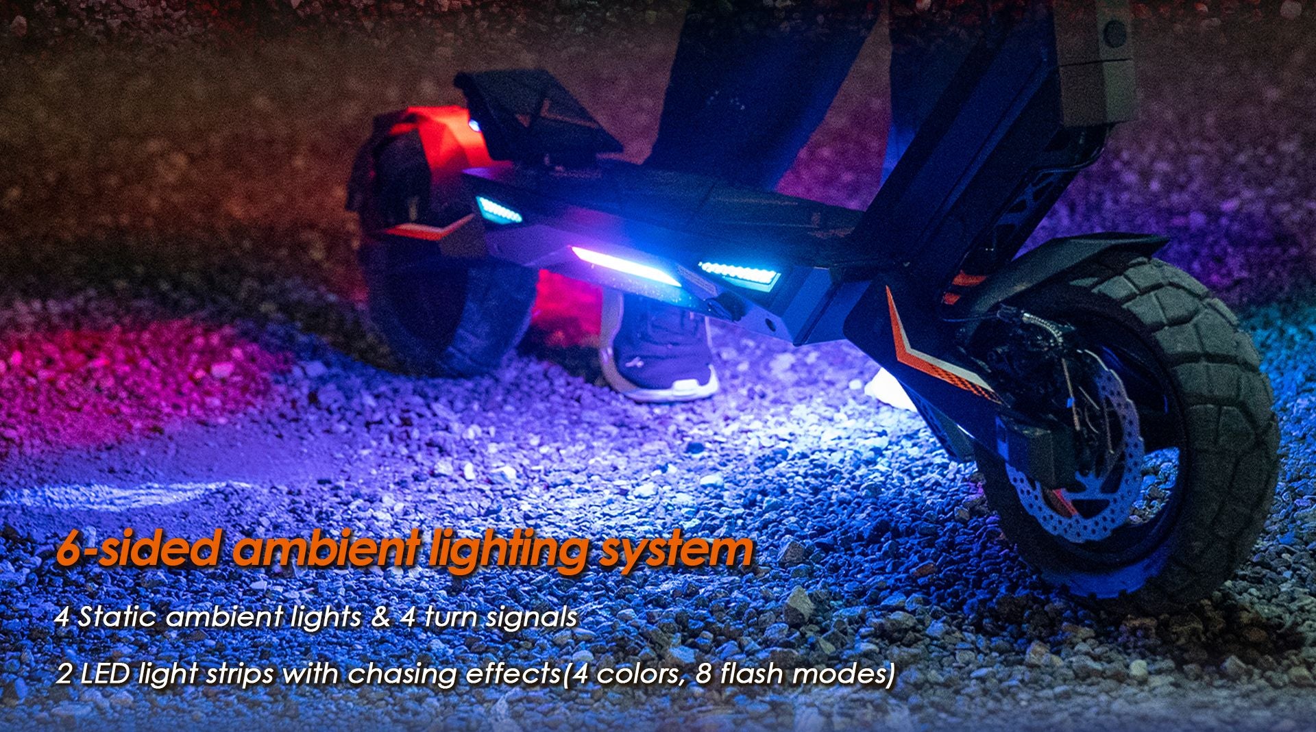 KuKirin T3 electric scooter 6‑sided RGB ambient lighting system, multi‑color LED light strips with chasing flash modes on gravel ground at night