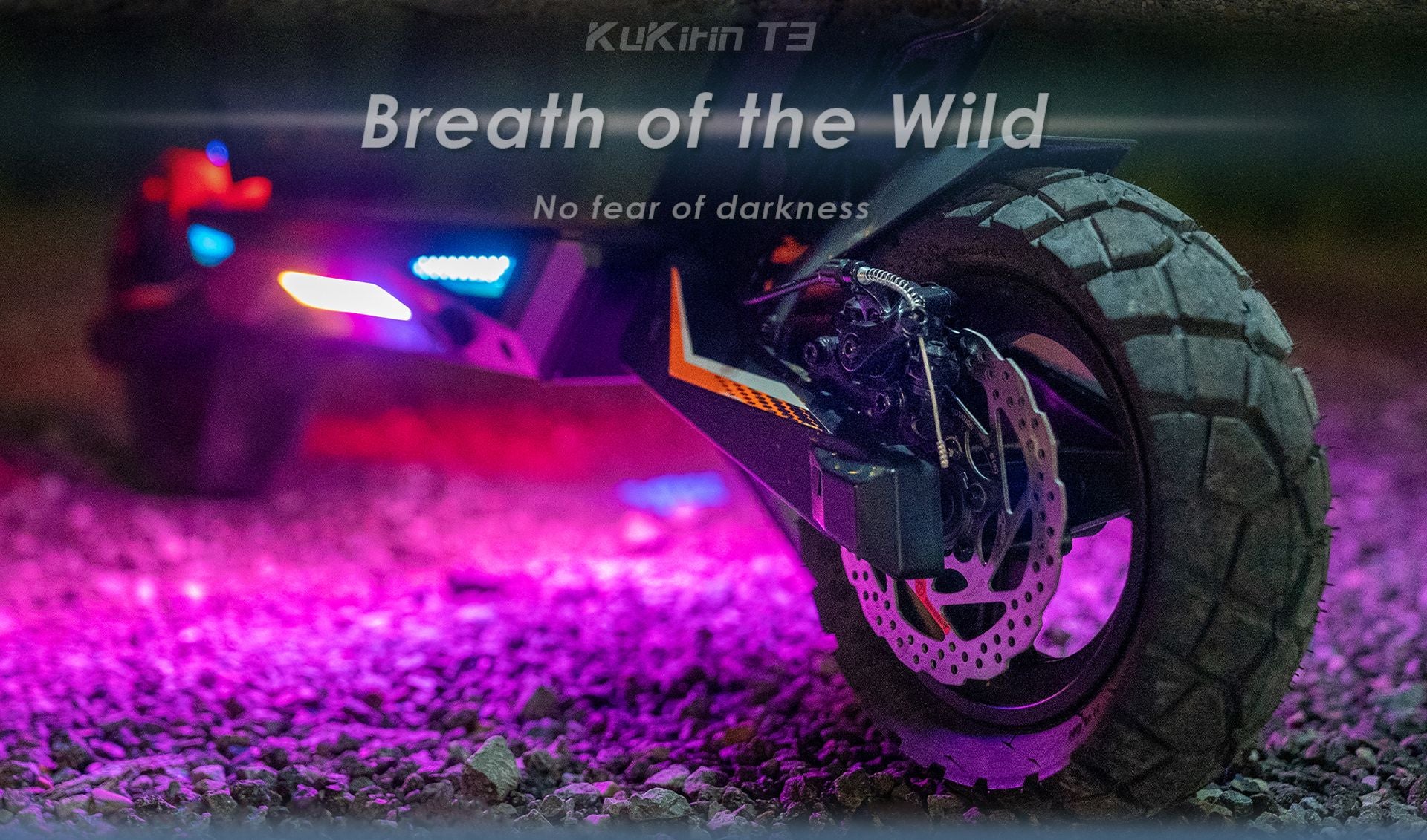 KuKirin T3 electric scooter night scene, colorful RGB ambient lighting, rear disc brake and off‑road tire close‑up